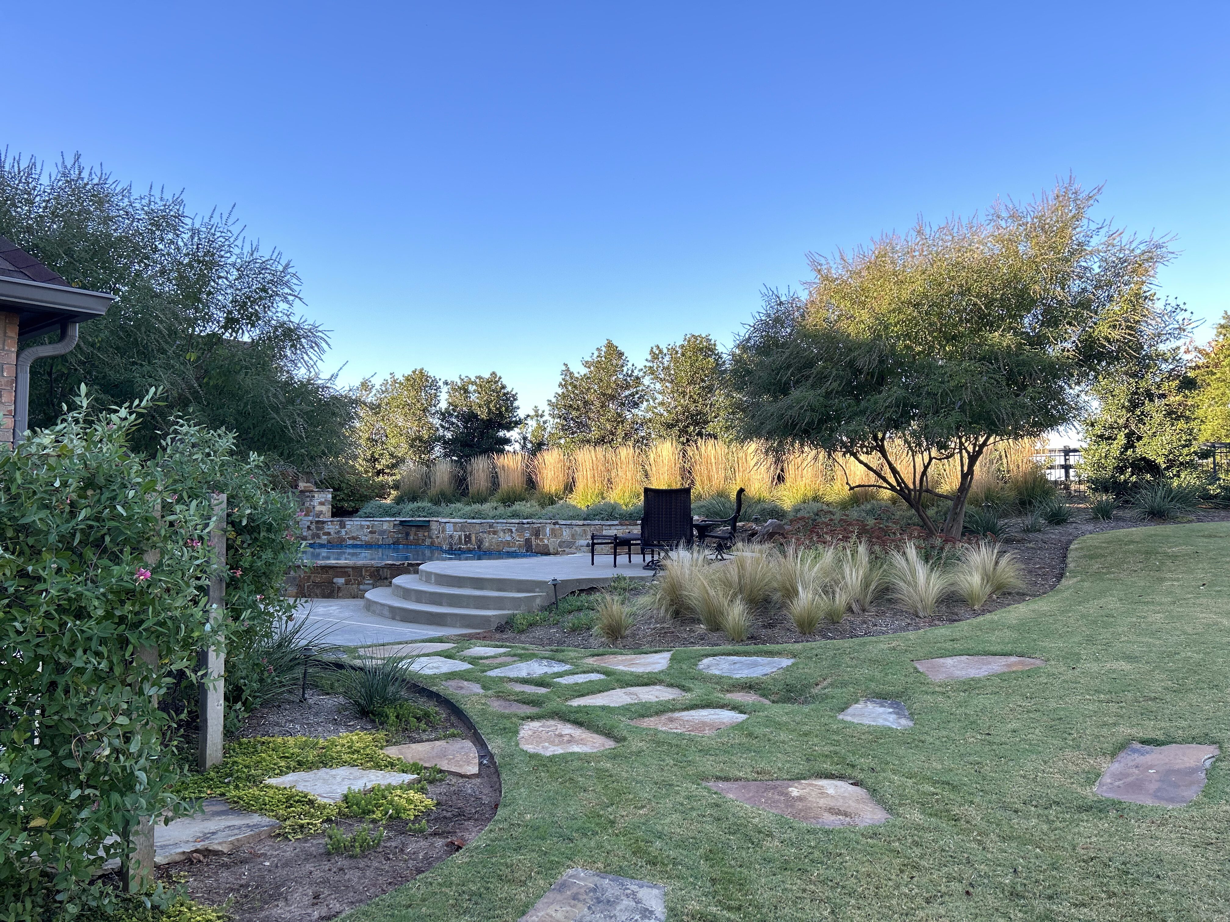 Outdoor Edmond landscape with flagstone pavers and stairs