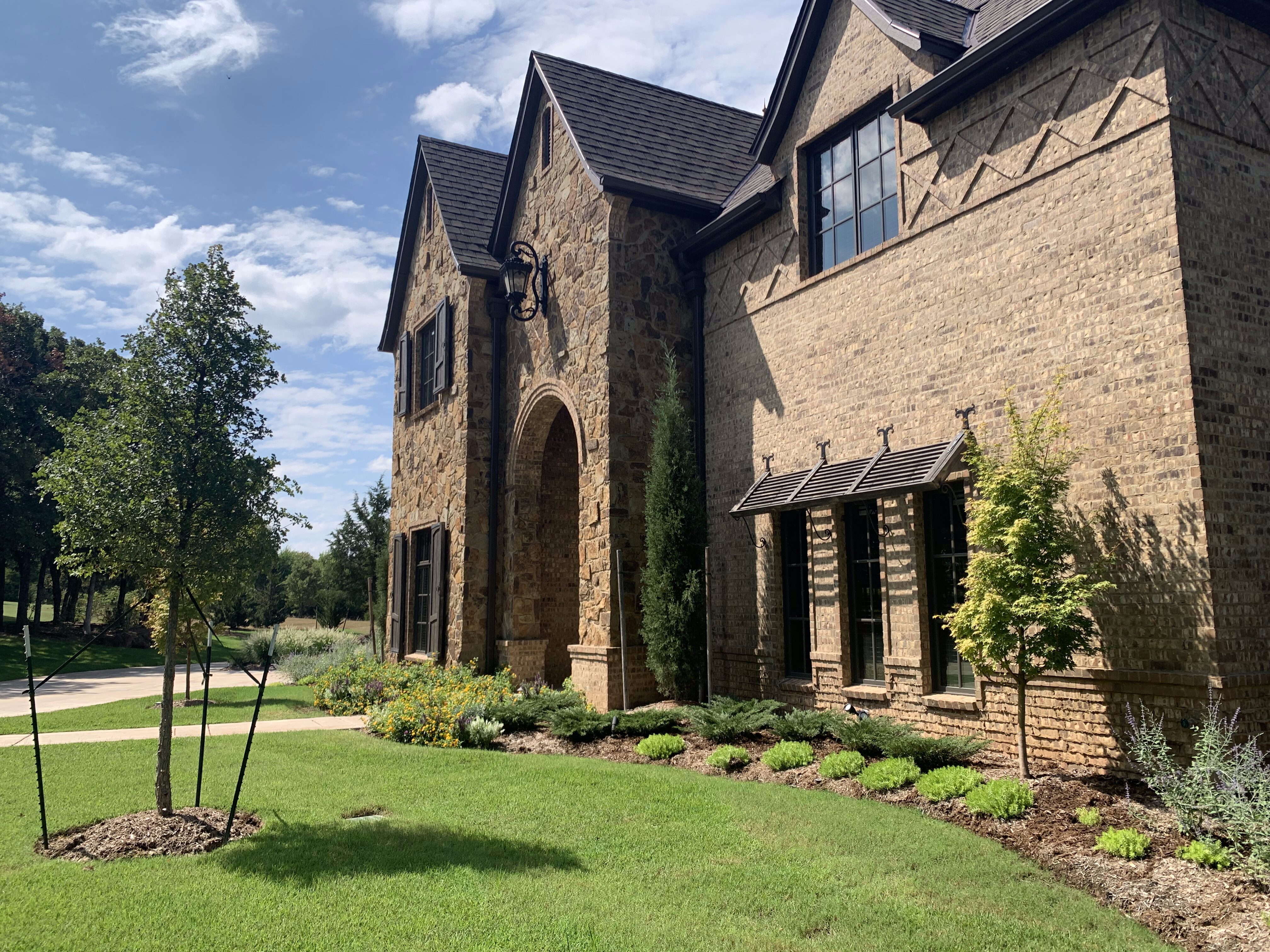 Cottage home with landscaping details