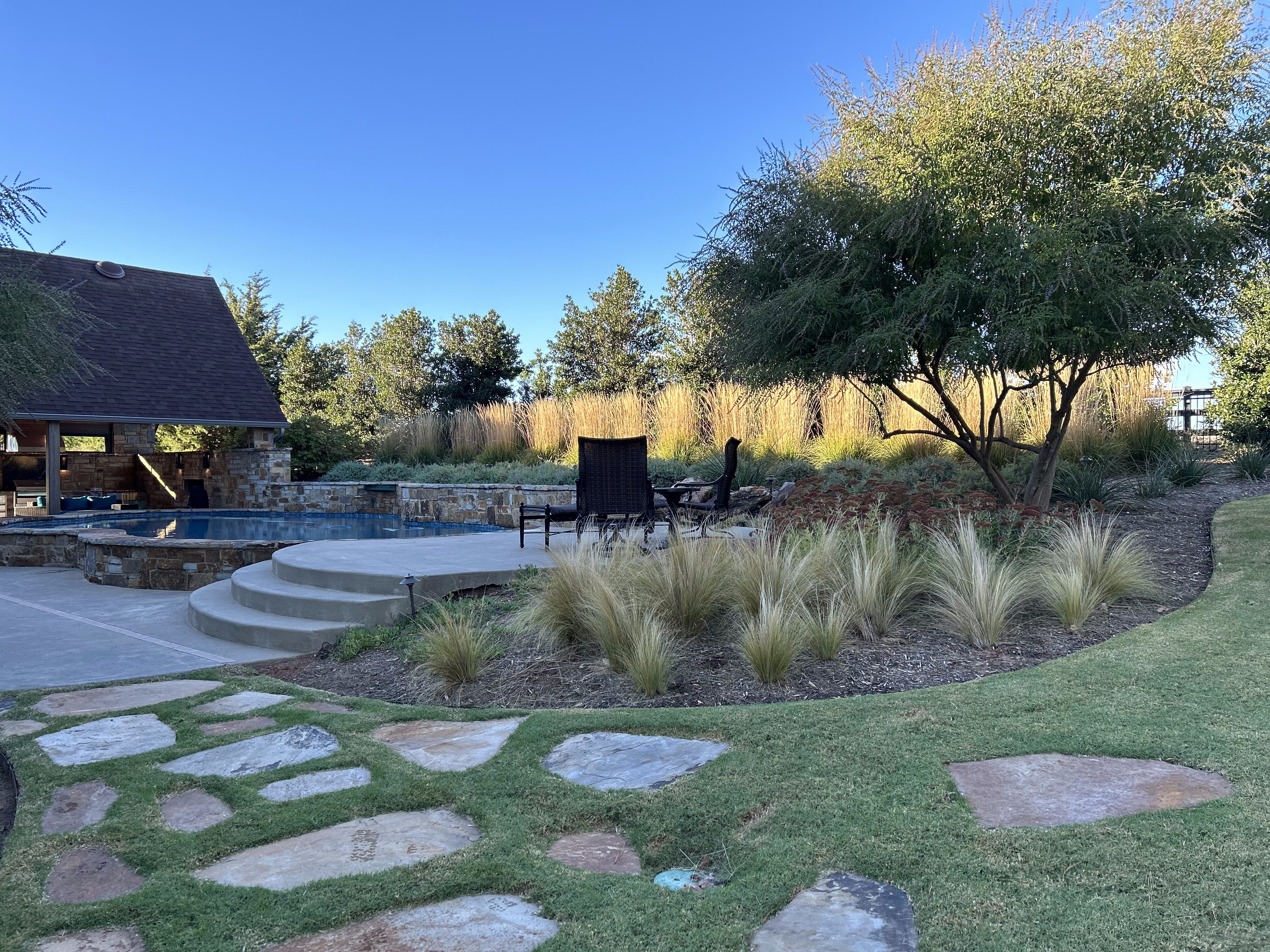 Outdoor Edmond landscape with flagstone pavers and stairs