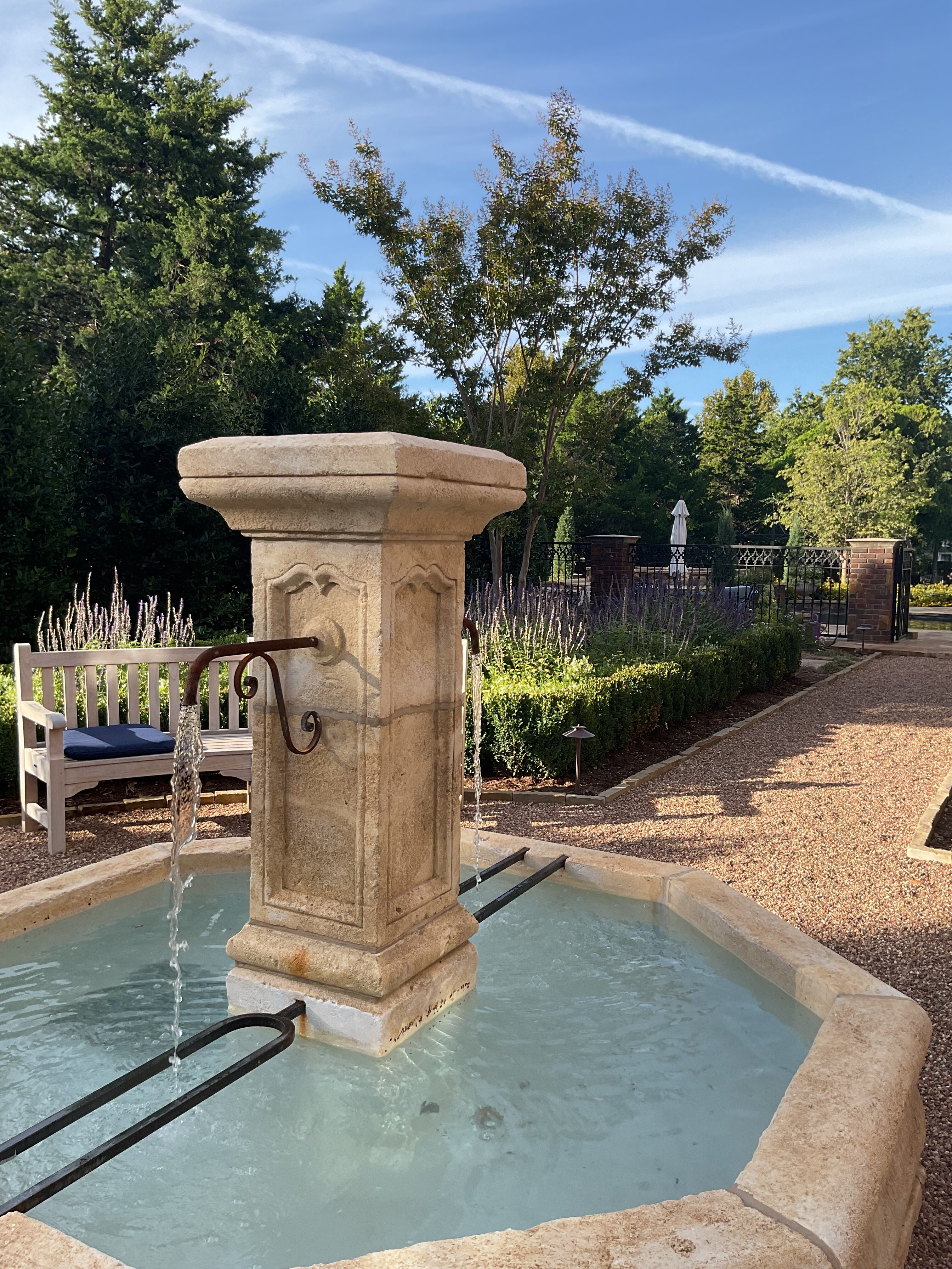 Water fountain in Nichols Hills English garden seating area