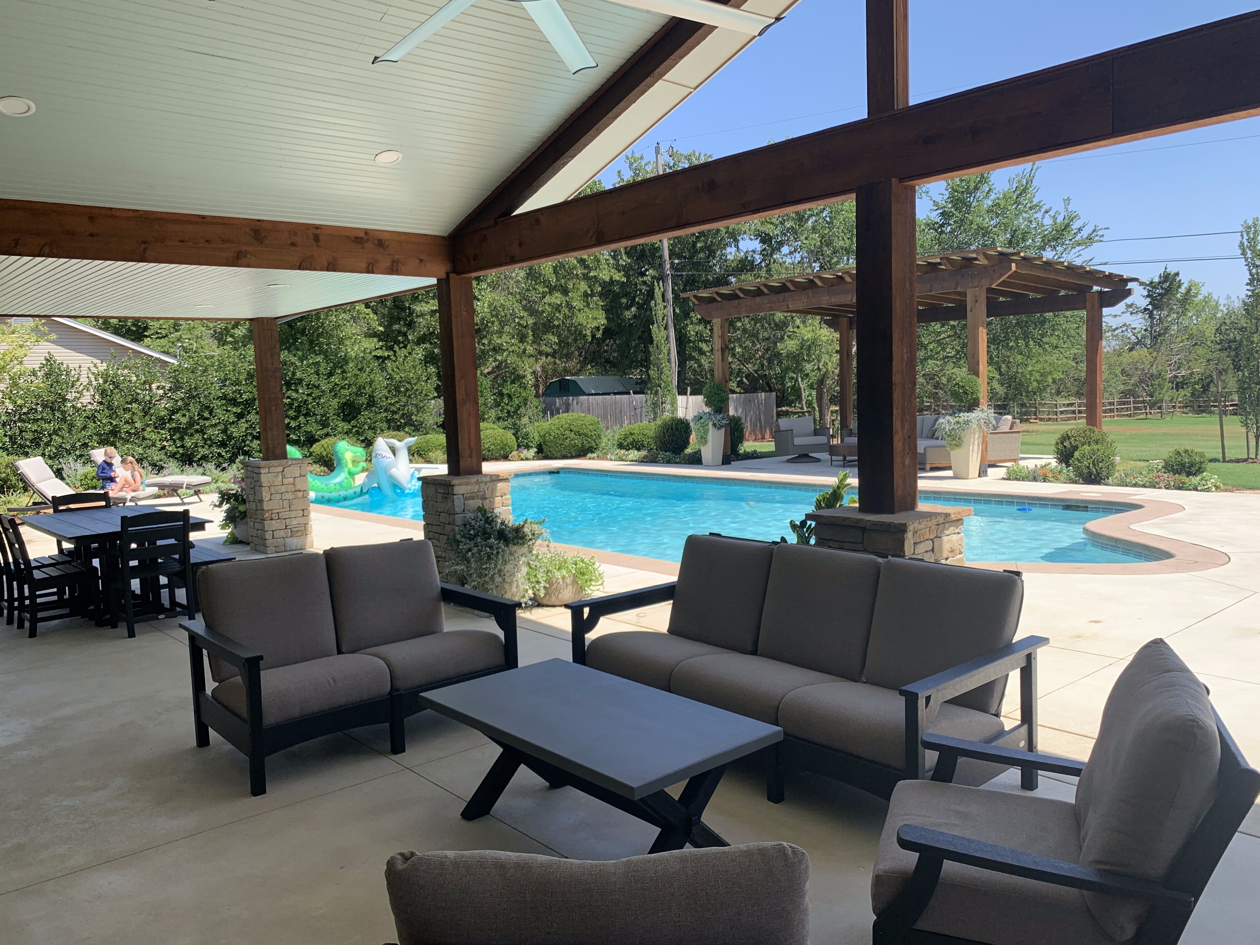 Outdoor living area with pool and pergola