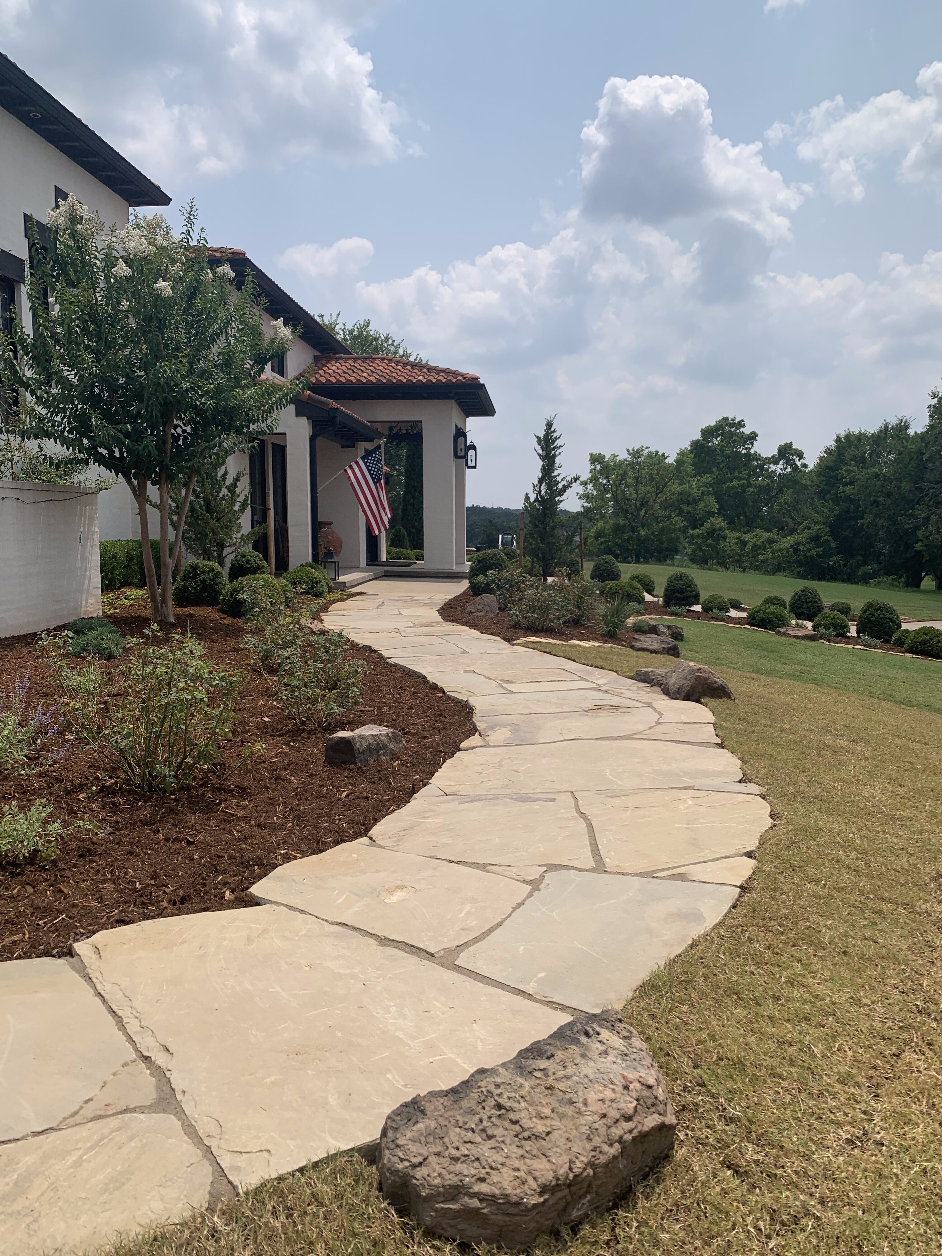Arcadia walkway with stone pavers and landscape