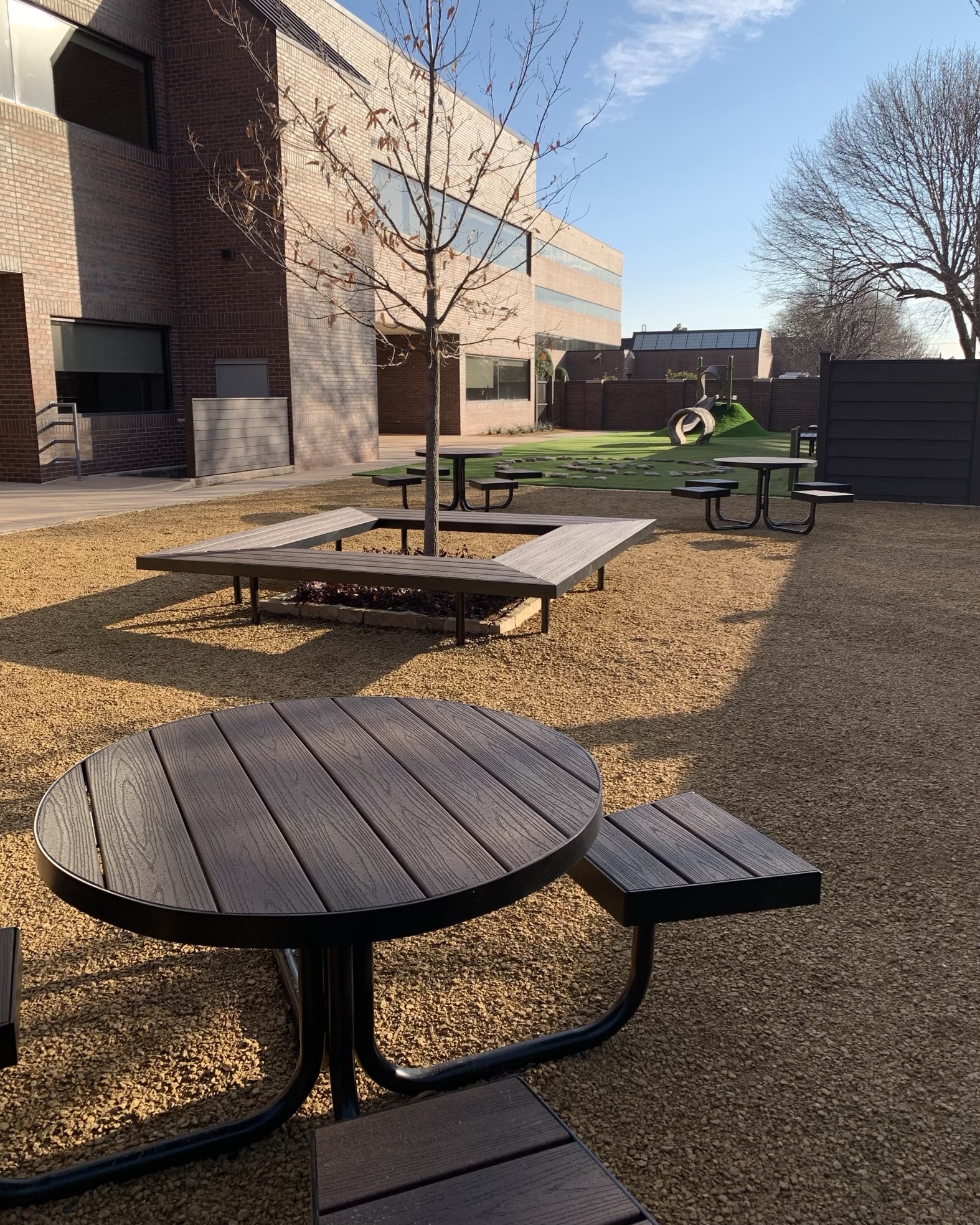 Playground with artificial grass and courtyard area