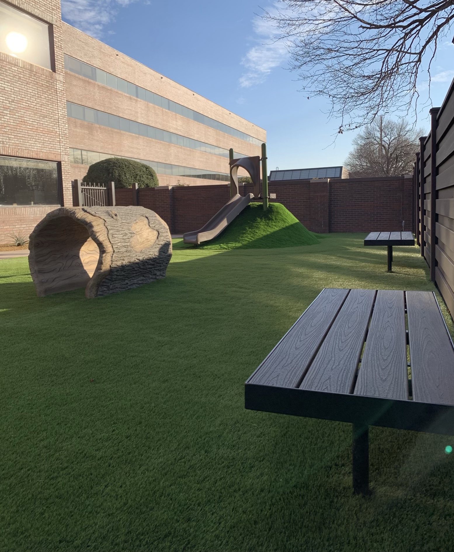 Playground with artificial grass and slide