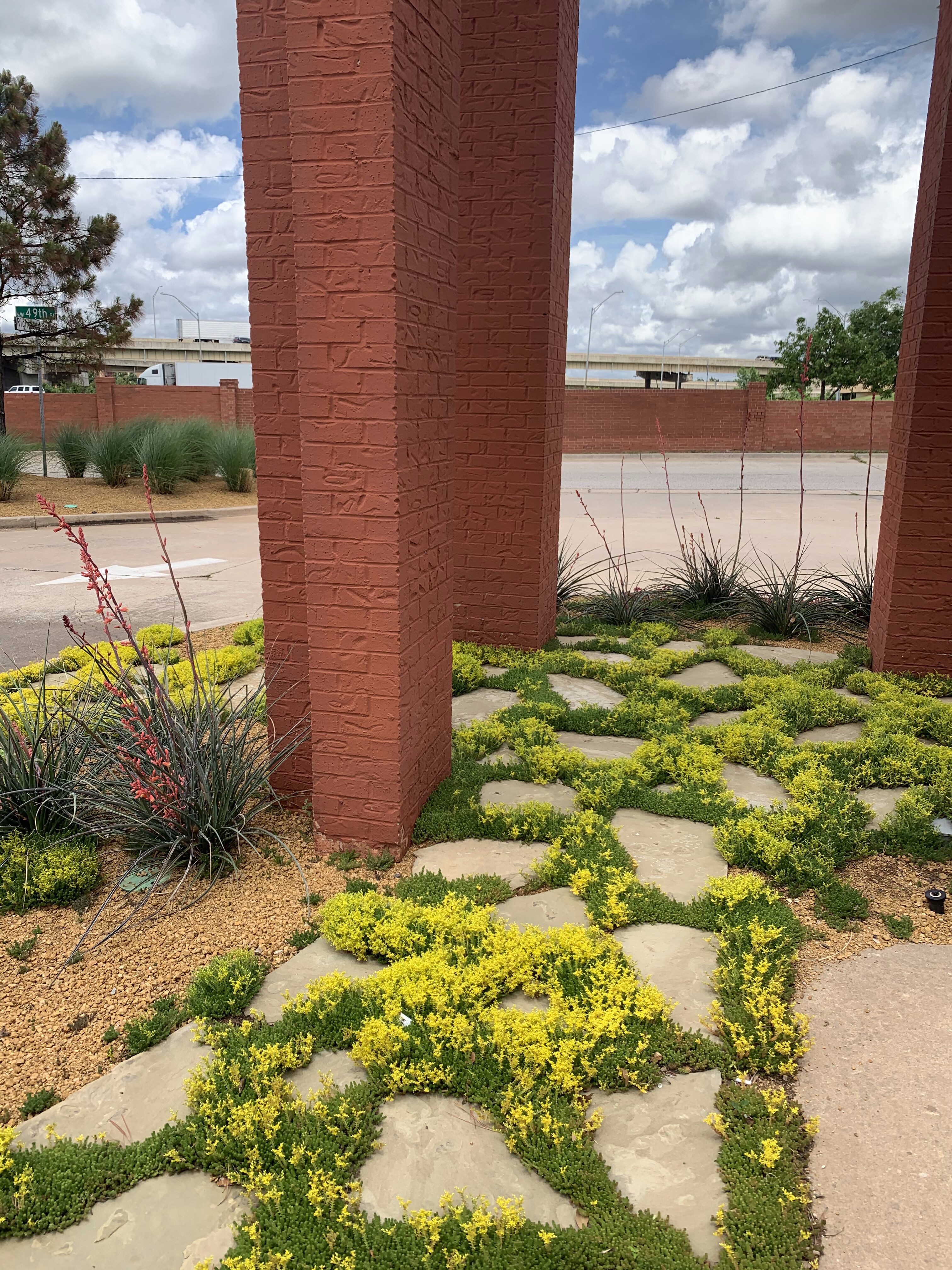 Pavers and drought-tolerant plants at an office building