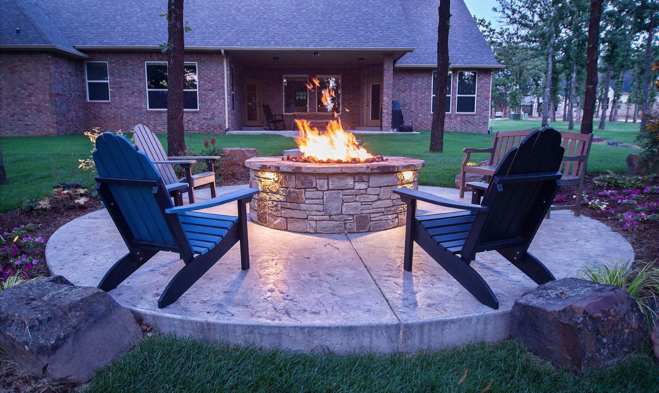 Outdoor seating area with stacked rock firepit