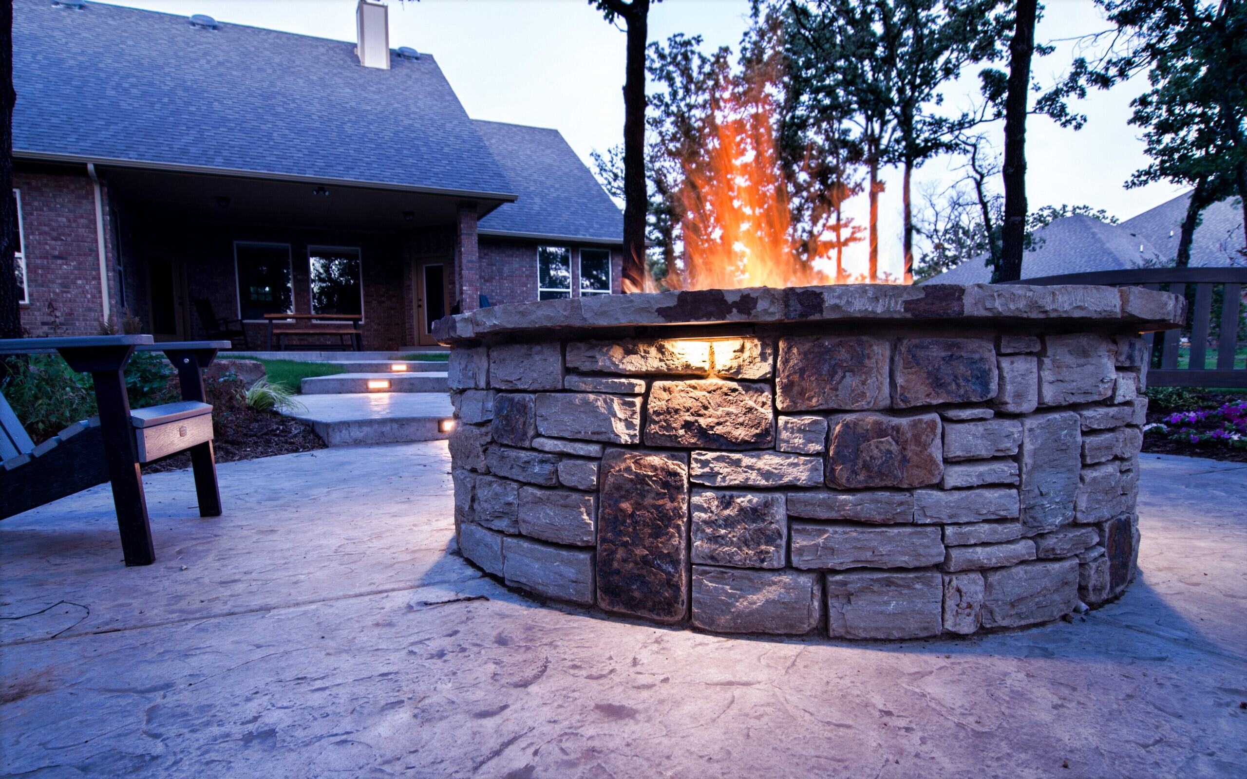Outdoor fireplace with stacked rock