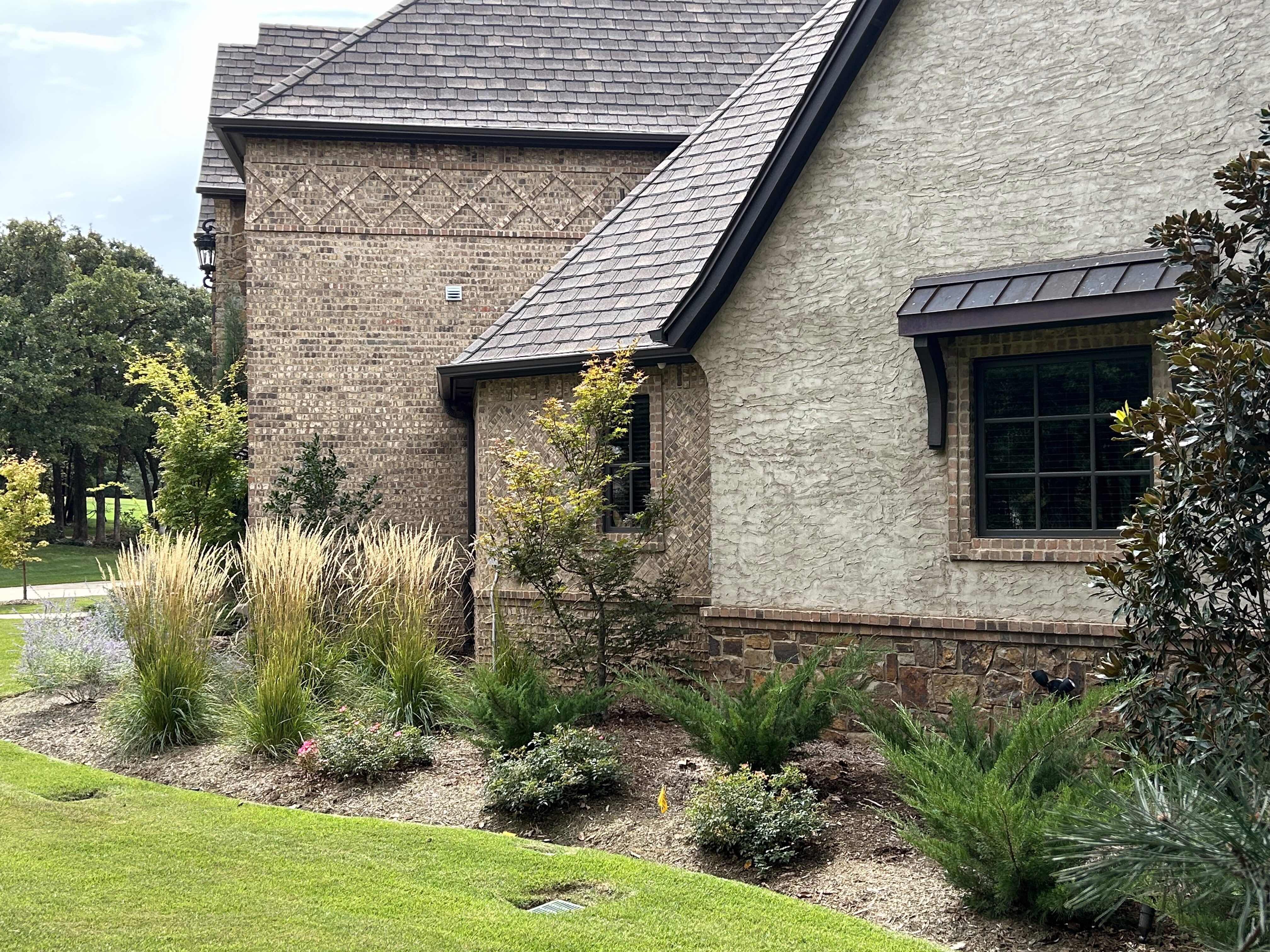 Landscape details on side of modern cottage house